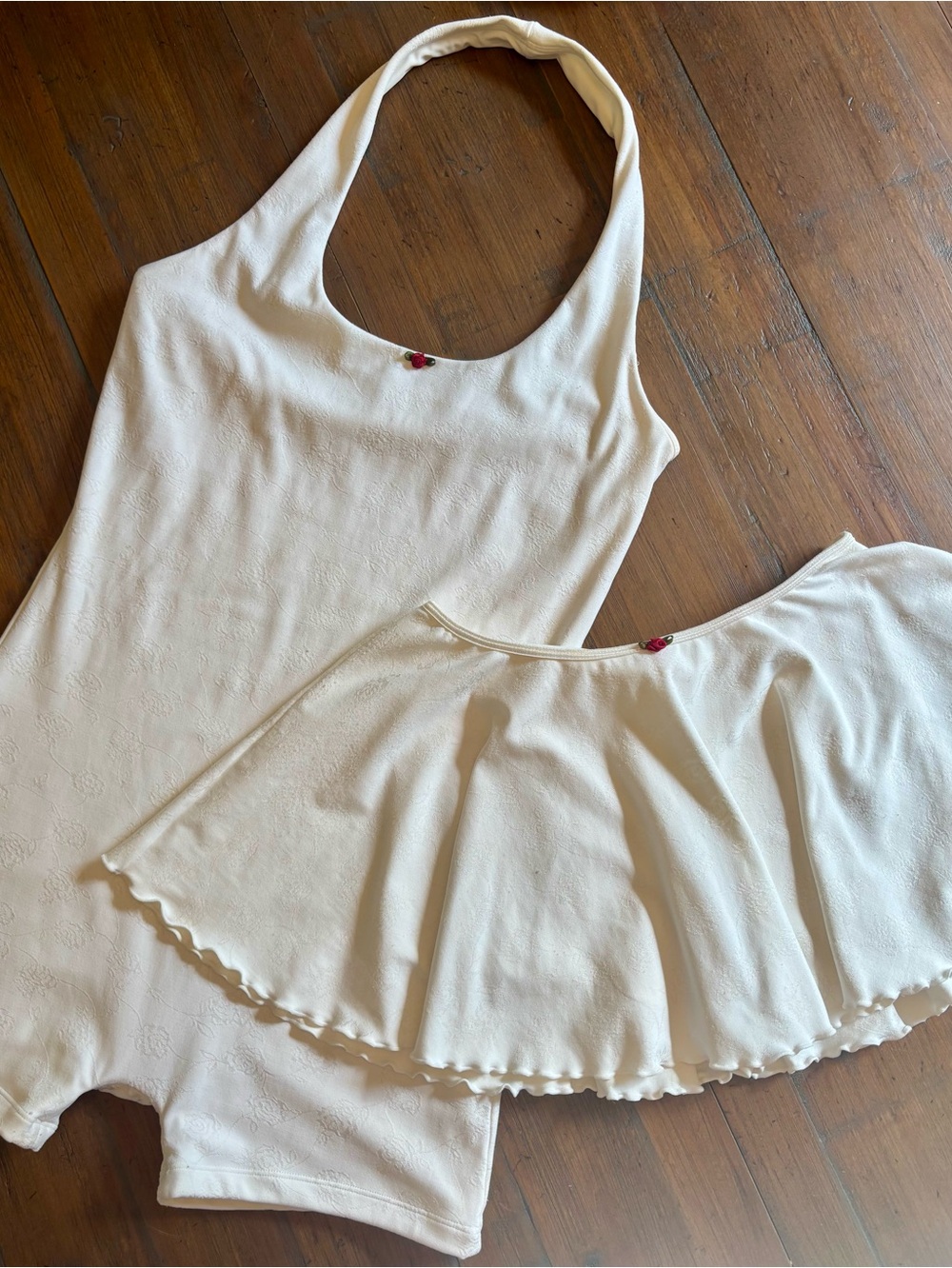 Frankie’s bikinis active romper and skort set